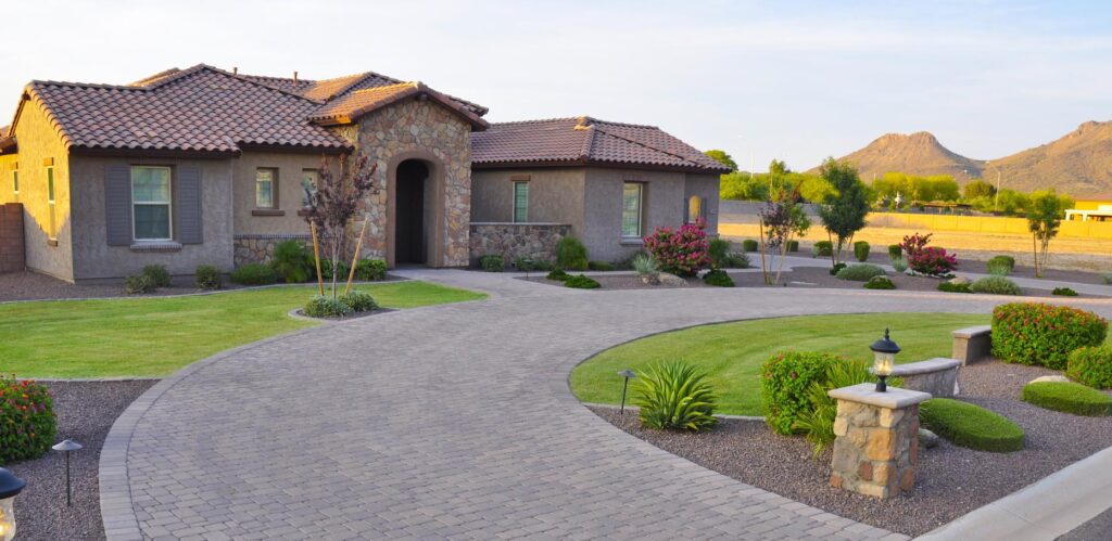 2024 landscaping trends: Driveway Landscaping with Desert Plants and Natural Grass. A project of Straight Line Landscape.