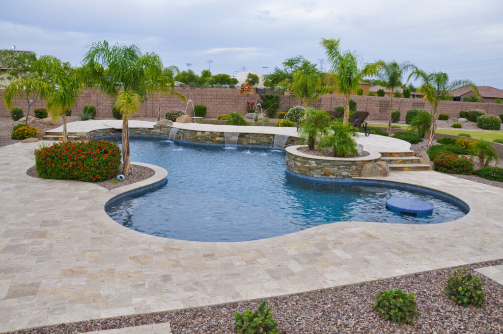 Palm Trees Surrounding a Swimming Pool. A landscaping idea from Straight Line Landscape.